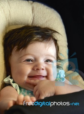 Very Happy Infant In Carseat Stock Photo