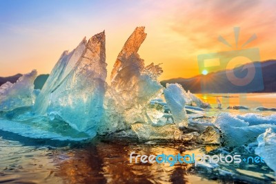 Very Large And Beautiful Chunk Of Ice At Sunrise In Winter Stock Photo