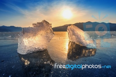 Very Large And Beautiful Chunk Of Ice At Sunrise In Winter Stock Photo