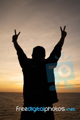 Victory Silhouette Man At Sunset Stock Photo