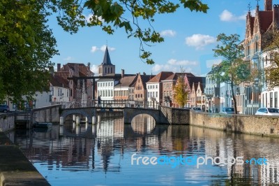 View Along A Canal In Bruges West Flanders In Belgium Stock Photo