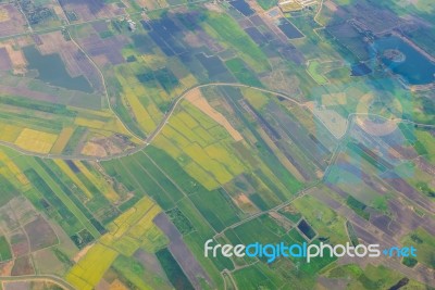 View From Airplane Window Flying Above The Rice Fields Stock Photo