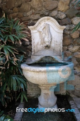 View Of A Fountain In The Alcazaba Fort And Palace Gardens In Ma… Stock Photo