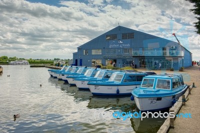 View Of Blue Boats For Hire At Potter Heigham Stock Photo