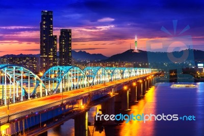 View Of Downtown Cityscape At Dongjak Bridge And Seoul Tower Over Han River In Seoul, South Korea Stock Photo