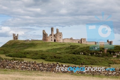 View Of Dunstanburgh Castle Stock Photo