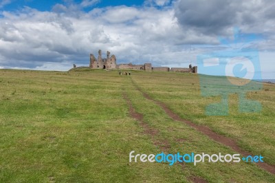 View Of Dunstanburgh Castle Stock Photo