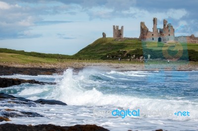 View Of Dunstanburgh Castle At Craster Northumberland Stock Photo