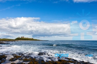 View Of Dunstanburgh Castle At Craster Northumberland Stock Photo