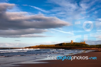 View Of Dunstanburgh Castle At Craster Northumberland Stock Photo