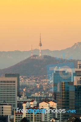 View Of Seoul Tower And Cityscape With Golden Light In Seoul, South Korea Stock Photo