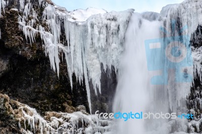 View Of Skogafoss Waterfall In Winter Stock Photo