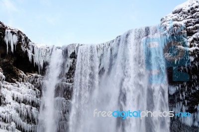 View Of Skogafoss Waterfall In Winter Stock Photo