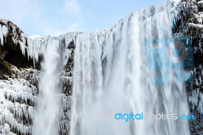 View Of Skogafoss Waterfall In Winter Stock Photo