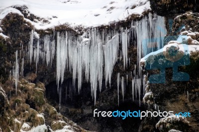 View Of Skogafoss Waterfall In Winter Stock Photo