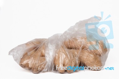 View Of Some Ginger Roots Inside A Plastic Bag Stock Photo