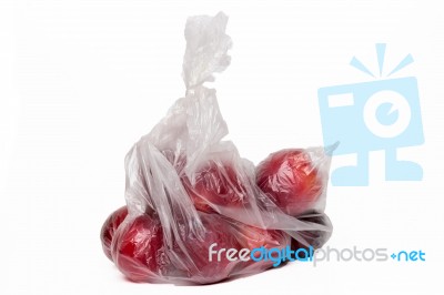 View Of Some Plums Inside A Plastic Bag Stock Photo