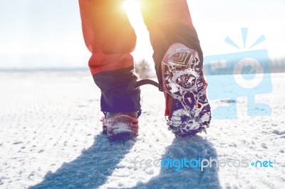 View Of Walking On Snow With Snow Shoes And Shoe Spikes In Winte… Stock Photo