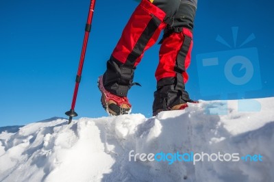 View Of Walking On Snow With Snow Shoes And Shoe Spikes In Winte… Stock Photo