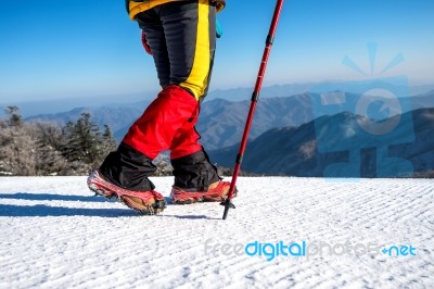 View Of Walking On Snow With Snow Shoes And Shoe Spikes In Winte… Stock Photo