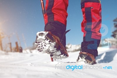 View Of Walking On Snow With Snow Shoes And Shoe Spikes In Winte… Stock Photo