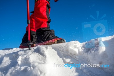 View Of Walking On Snow With Snow Shoes And Shoe Spikes In Winte… Stock Photo