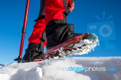 View Of Walking On Snow With Snow Shoes And Shoe Spikes In Winte… Stock Photo