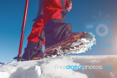 View Of Walking On Snow With Snow Shoes And Shoe Spikes In Winte… Stock Photo