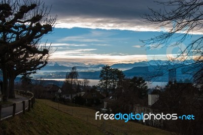 View Over Lake Of Zurich Into Snowy Mountains Stock Photo