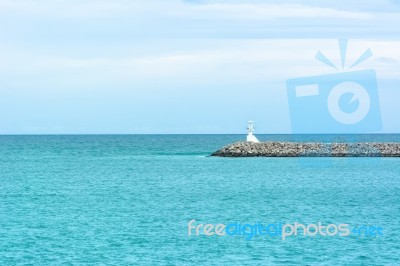 View Seascape Wit Lighthouse And Blue Sky Stock Photo