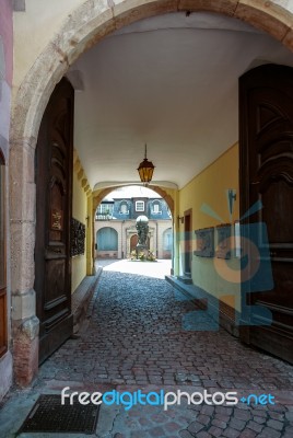 View Through Double Wooden Doors Into A Courtyard In Strasbourg Stock Photo