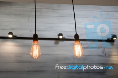 Vintage Bulbs On Wall Background Stock Photo