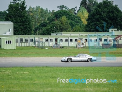 Vintage Car Driving Around Dunsfold Airfield Stock Photo