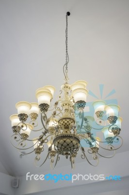 Vintage Chandelier Light Bulb In Dark Room Stock Photo