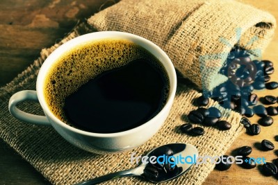 Vintage Coffee Cup With Coffee Bean Stock Photo