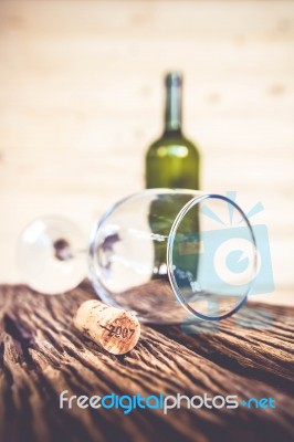 Vintage Cork From Wine Bottle And Glass On The Old Wood Floor Stock Photo