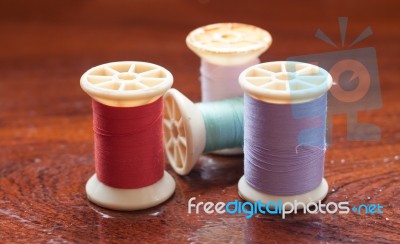 Vintage Grunge Colorful Thread Spool On Wooden Table Stock Photo