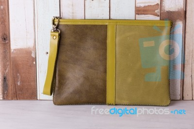 Vintage Leather Bag On Grunge Wooden Background Stock Photo