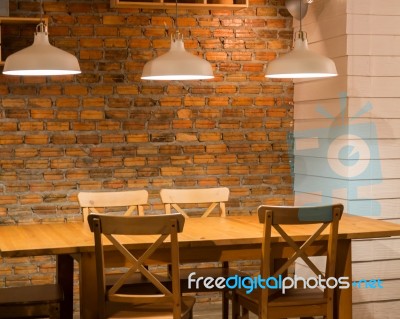 Vintage Light Bulb Over Wooden Table Stock Photo