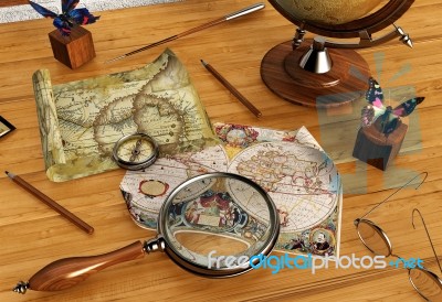 Vintage Maps And Magnifying Glass On Wood Table Stock Image