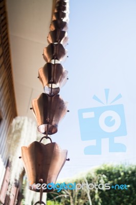 Vintage Metallic Bells Used For Rain Waters Way-out In Zen Garde… Stock Photo