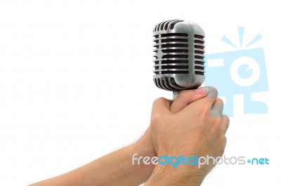 Vintage Microphone With Hands Isolated Stock Photo