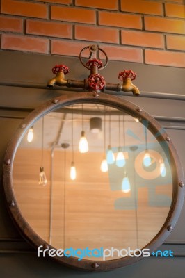 Vintage Mirror Decorated On Old Style Wall Stock Photo