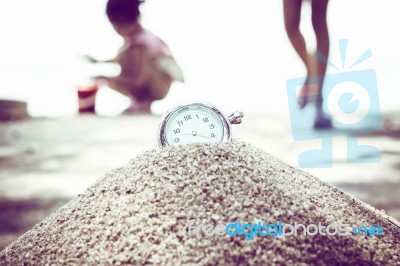 Vintage Pocket Watch On Sand Stock Photo