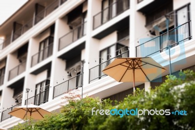 Vintage Residential Building Decorated With Green Tree Stock Photo