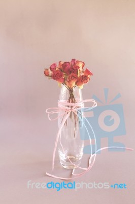 Vintage Style Roses In Glass Vase Stock Photo