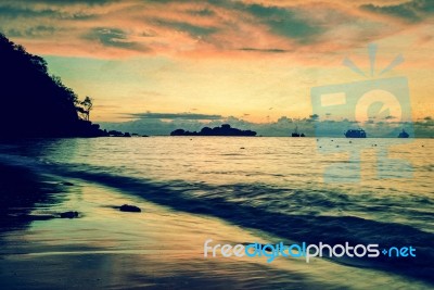 Vintage Stylized Photo Of Sunrise On The Beach Stock Photo