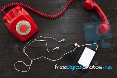 Vintage Telephone Vs Smartphone Stock Photo