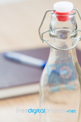 Vintage Water Bottle On Wooden Background Stock Photo