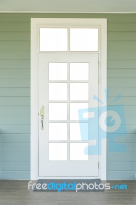 Vintage White Door On The Green Wall Stock Photo